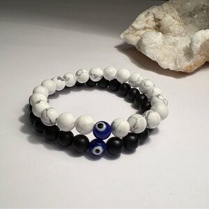 Handmade Black and White Beaded Bracelet set with Blue Evil Eye Accent bead.